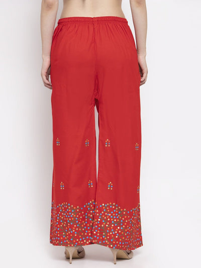 Red rayon printed palazzo with elasticated waistband and colorful hem detailing.