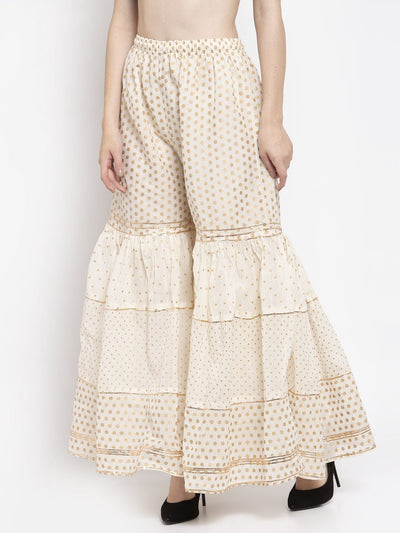 Off-White Gotta Gharara with elasticated waistband and gold polka dot pattern.