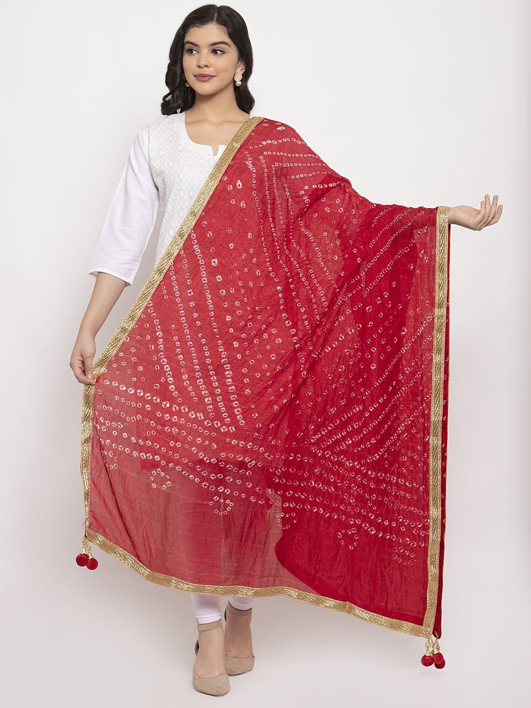 Red Bandhani Gotta Patti Silk Dupatta styled on model with white kurta.