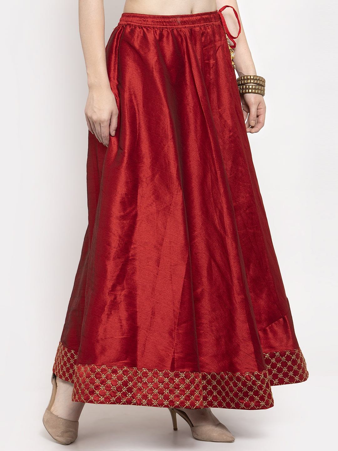 Maroon flared embellished skirt in raw silk fabric.