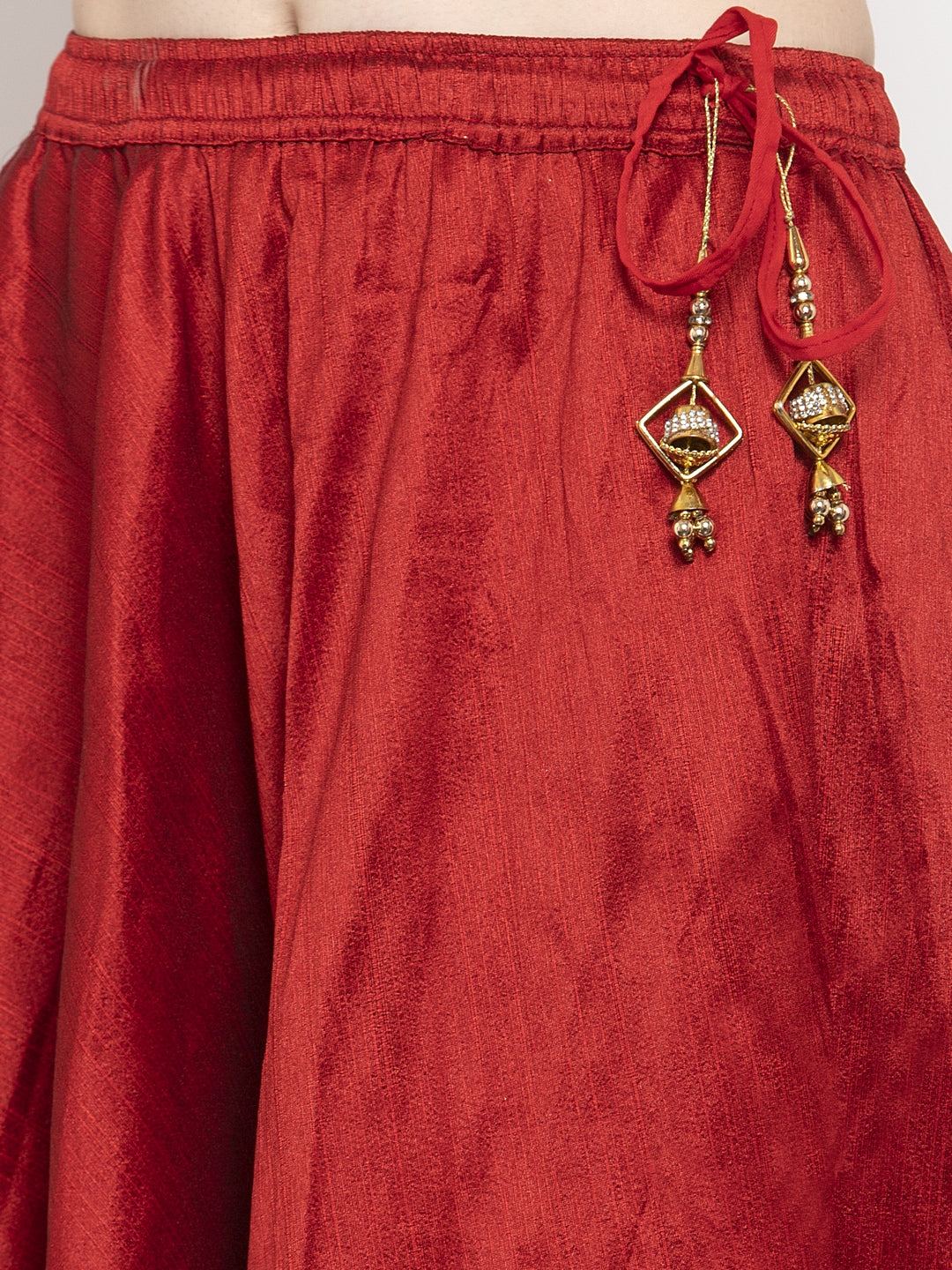 Maroon flared embellished skirt made from raw silk fabric.