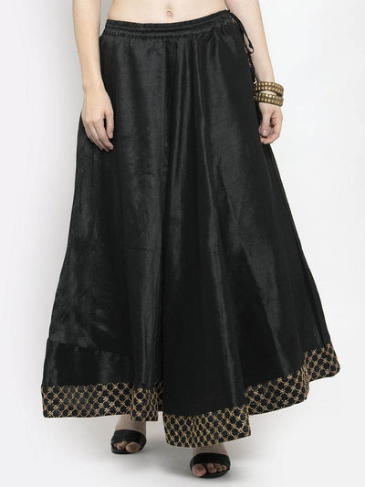 Black flared embellished skirt in raw silk fabric.