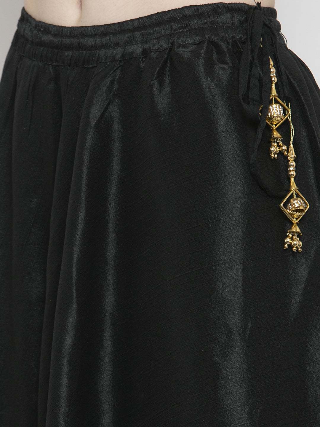 Black flared embellished skirt in Raw Silk with decorative details.