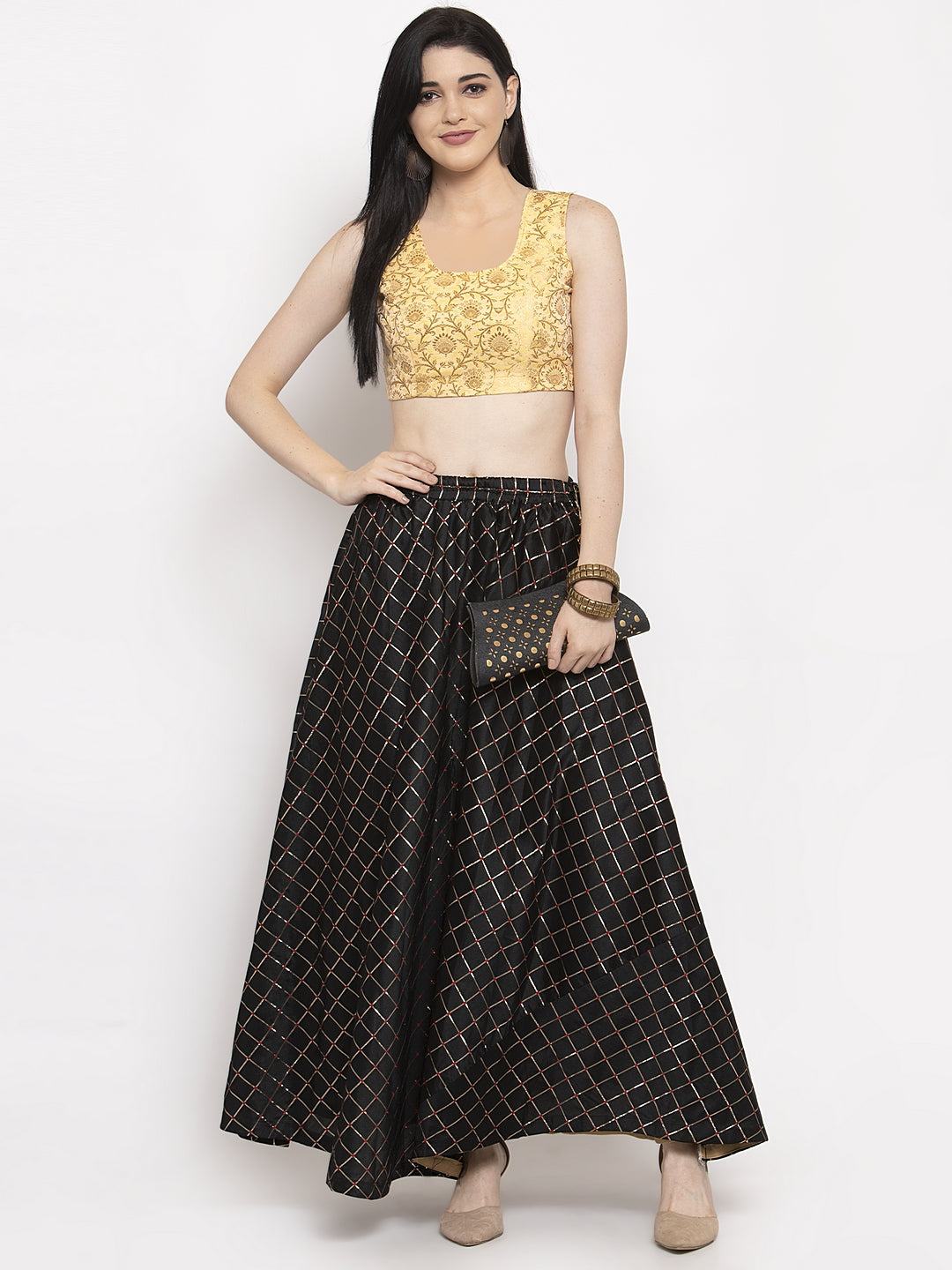 Black printed maxi skirt made of silk fabric, styled with a blouse and high heels for a chic look.