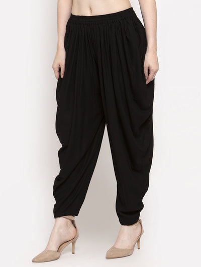 Black solid rayon dhoti salwar with elasticated waistband and drawstring.