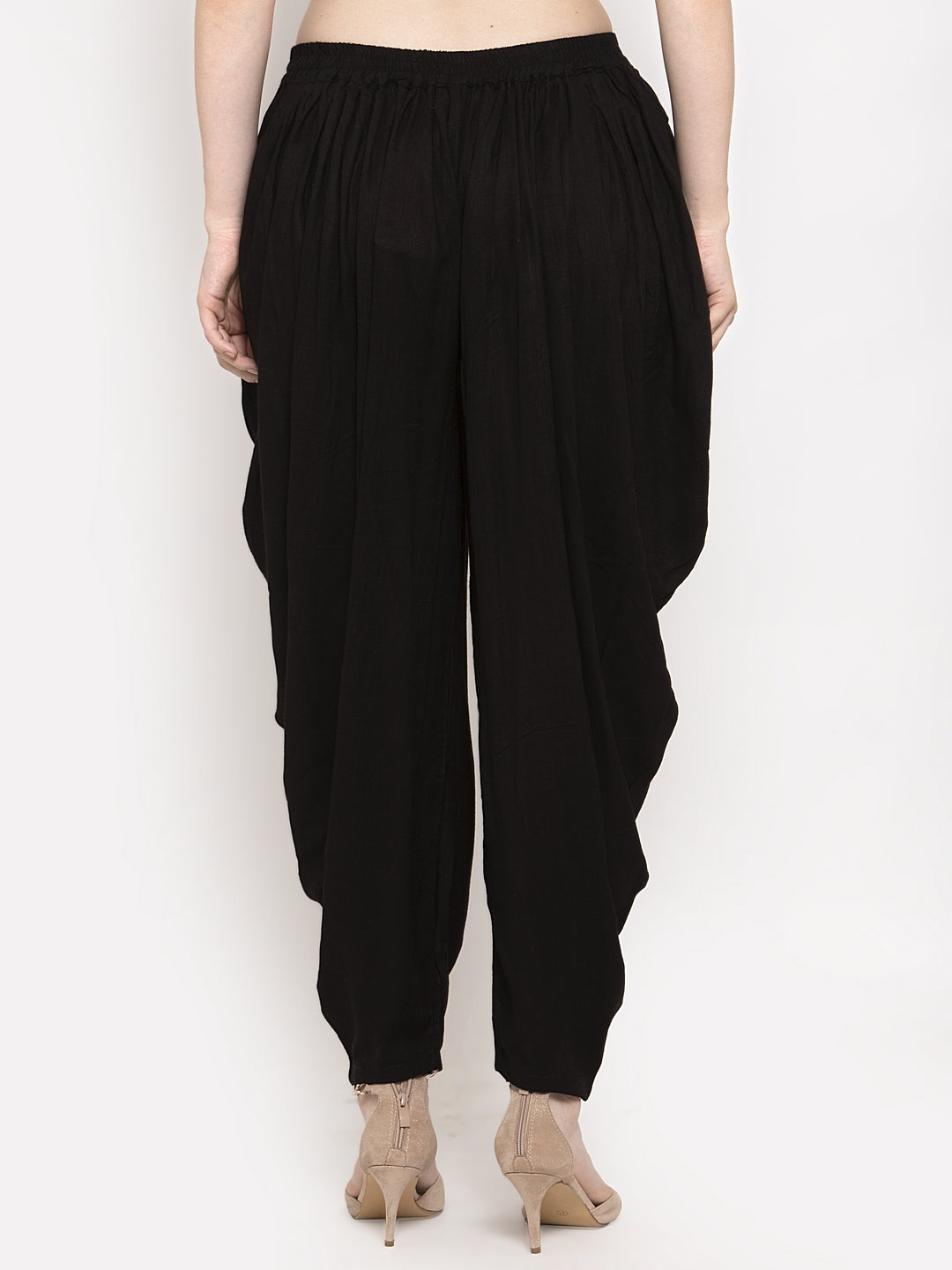 Black solid rayon dhoti salwar with elasticated waistband and drawstring.