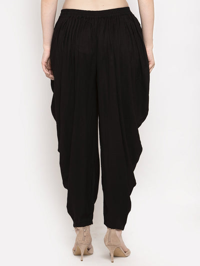 Black solid rayon dhoti salwar with elasticated waistband and drawstring.