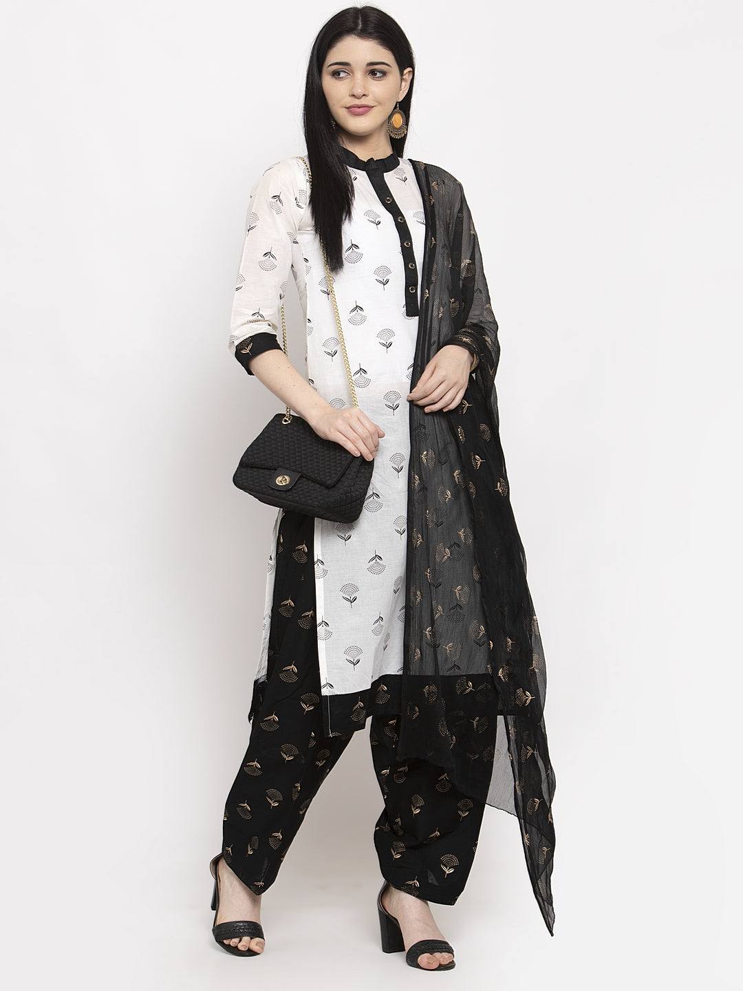 Black printed salwar dupatta set with cotton fabric, enhancing a solid colored kurta.
