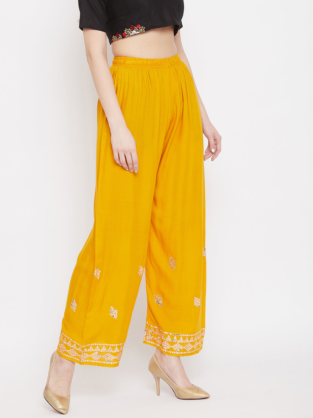 Mustard embellished rayon palazzo with mirror work and elasticated waistband.