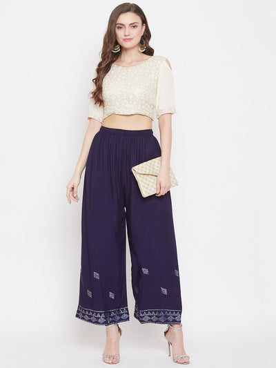 Navy blue embellished rayon palazzo with mirror work and elastic waistband.