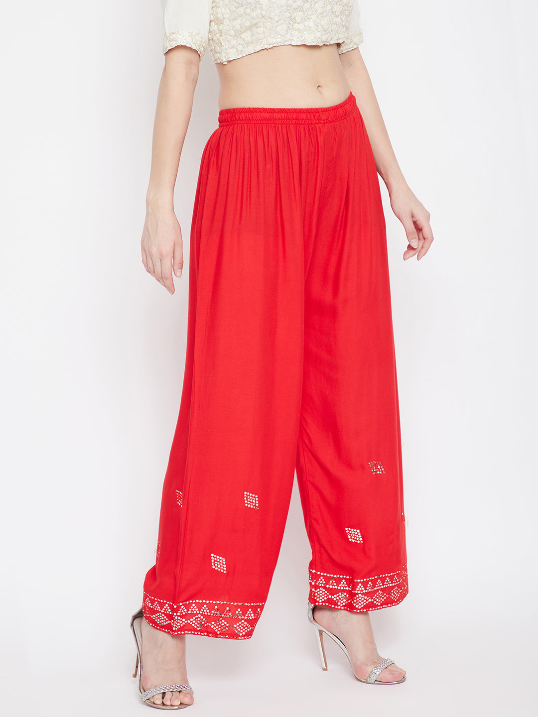 Red Embellished Rayon Palazzo with elasticated waistband and mirror work hem.