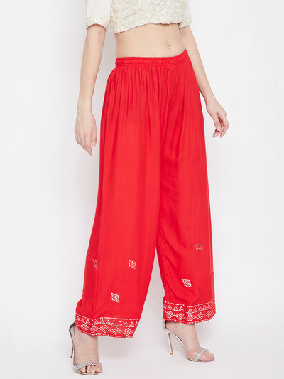 Red Embellished Rayon Palazzo with elasticated waistband and mirror work hem.