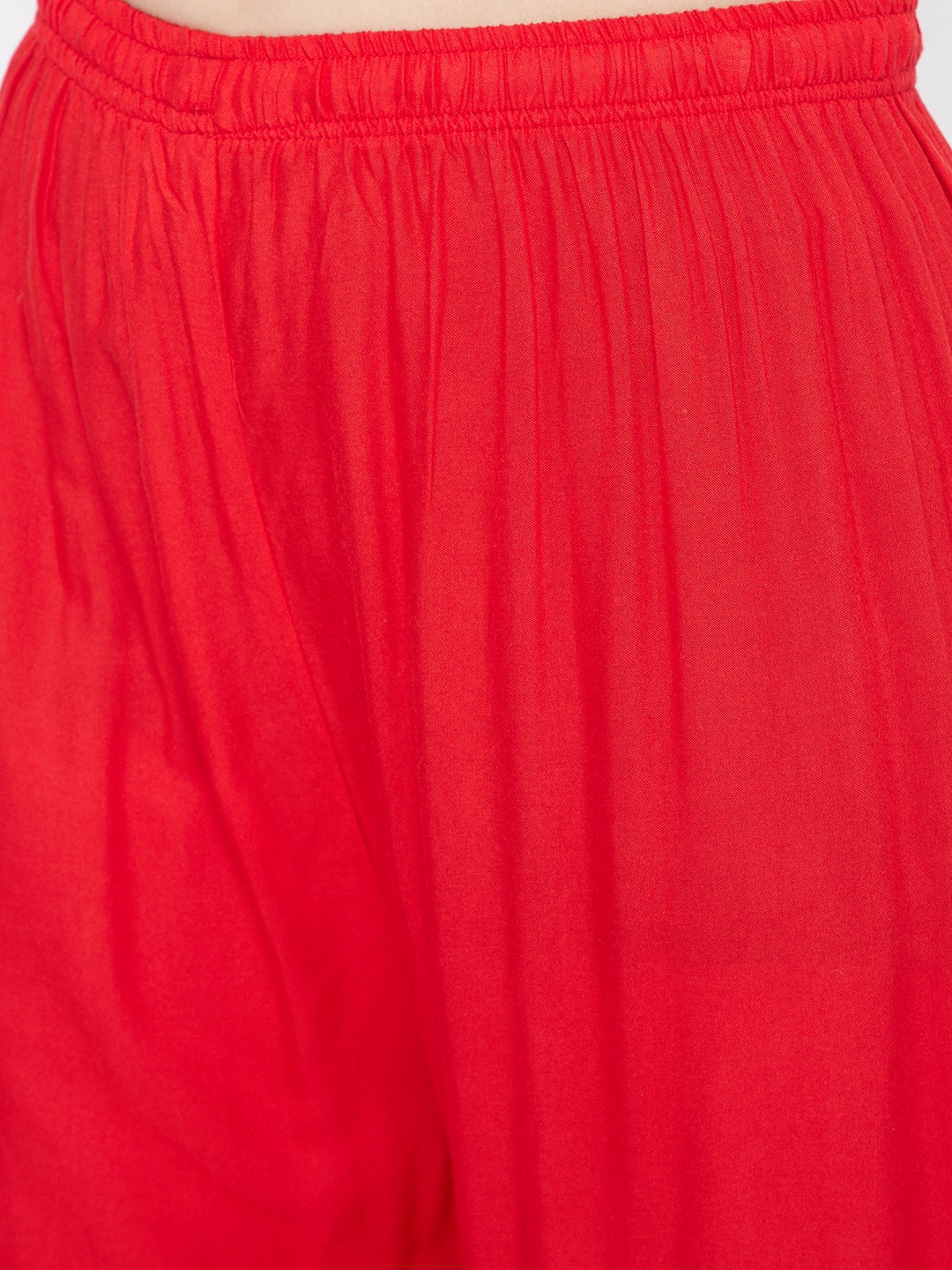 Red Embellished Rayon Palazzo with elastic waistband and mirror work hem.