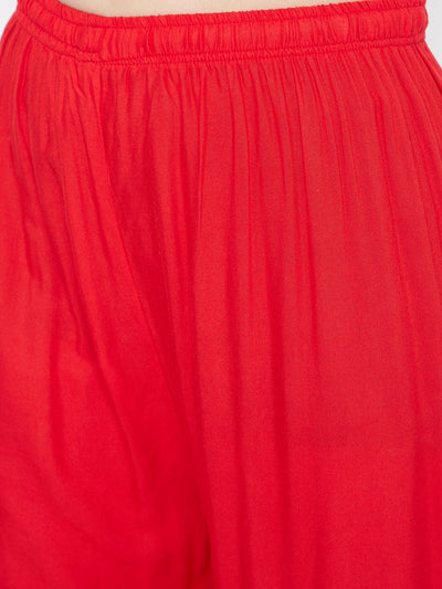 Red Embellished Rayon Palazzo with elastic waistband and mirror work hem.