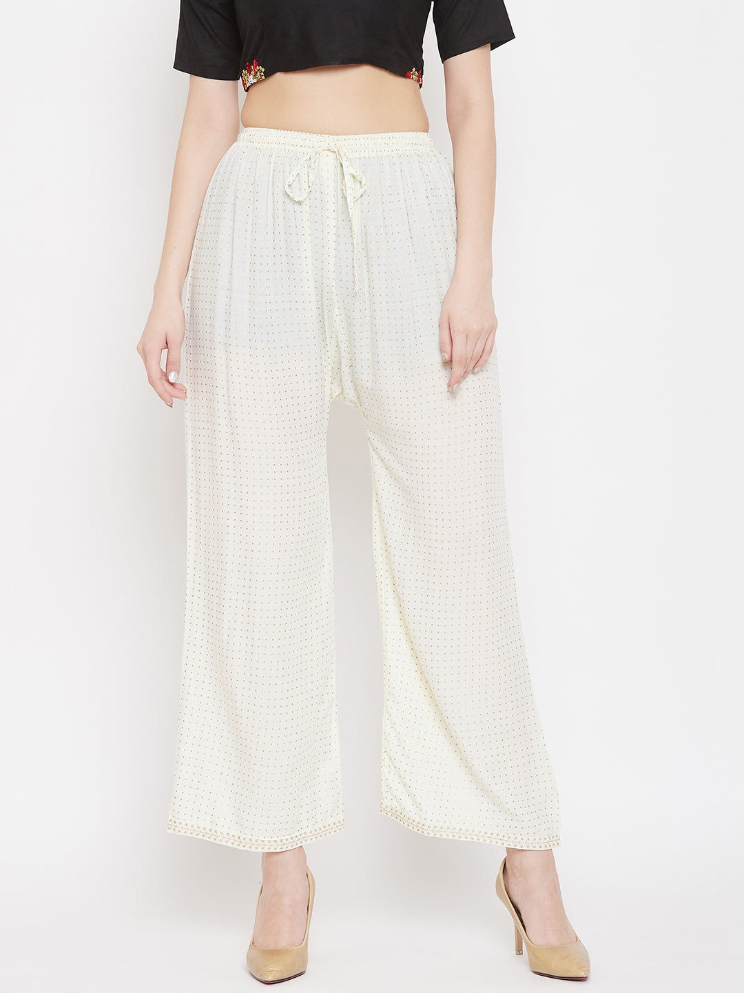 Cream straight printed palazzo in rayon fabric on model.