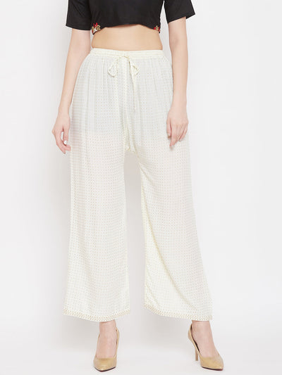 Cream straight printed palazzo in rayon fabric on model.