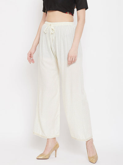 Cream straight printed palazzo in rayon with a stylish design.