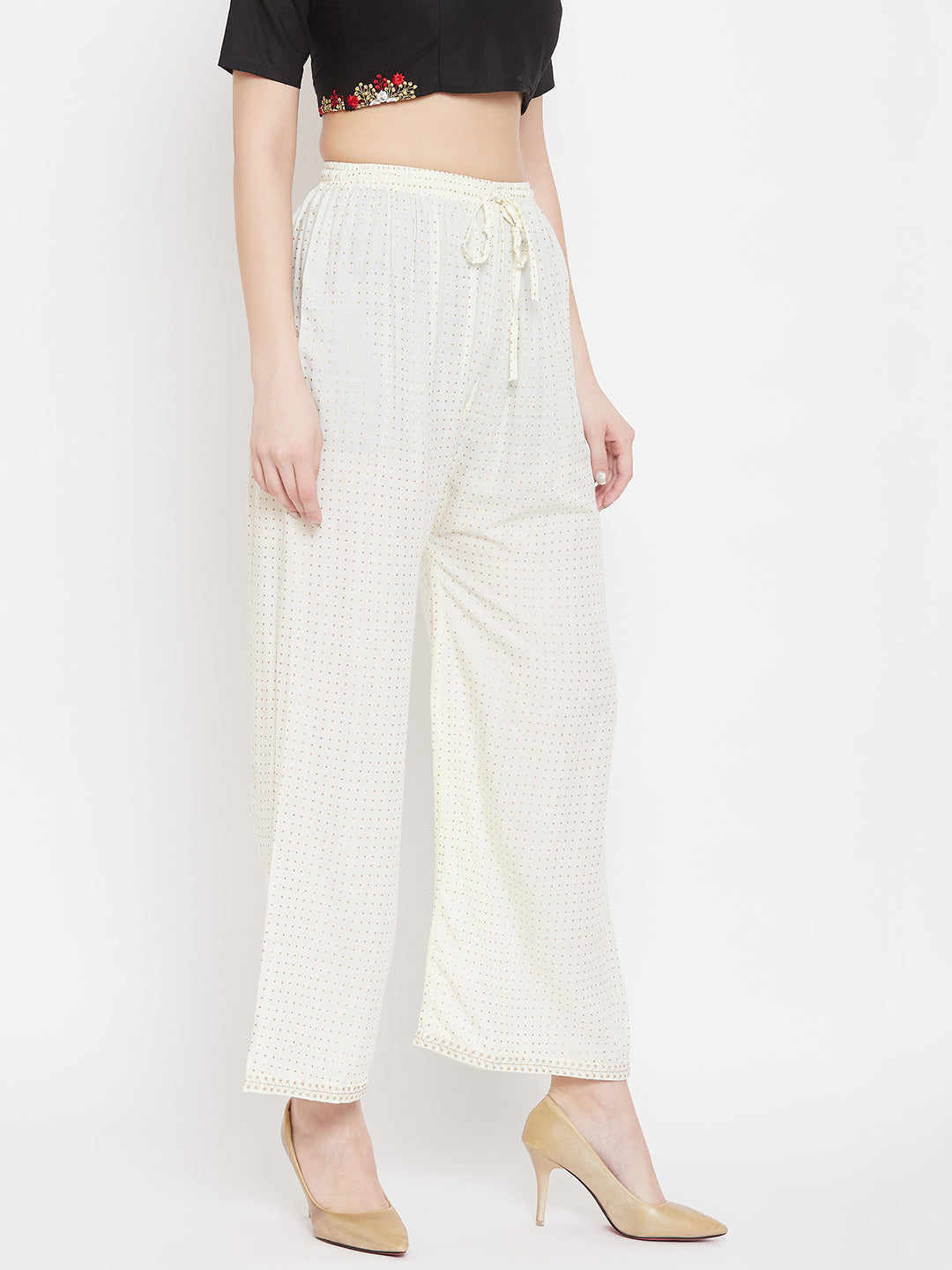 Cream straight printed palazzo made from rayon, styling option with heels.