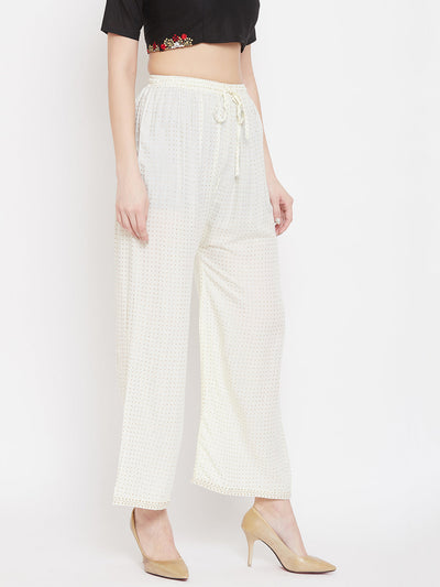 Cream straight printed palazzo made from rayon, styling option with heels.