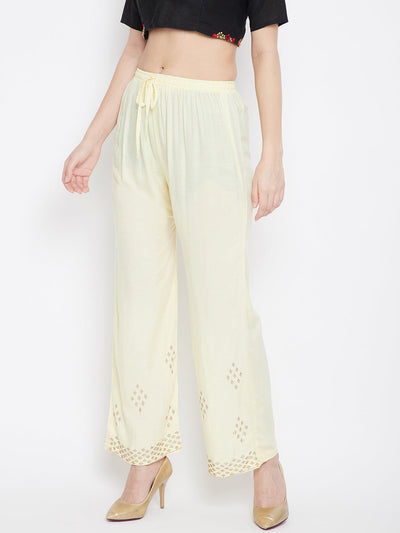 Cream straight embellished palazzo with elasticated waistband and stone work hem.