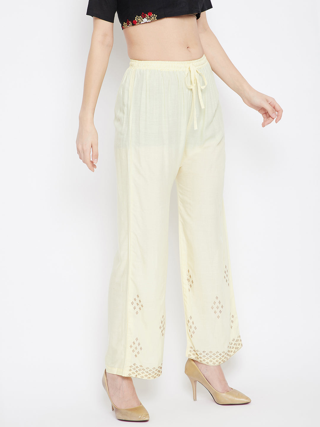 Cream straight embellished palazzo with stone work hem and elasticated waistband.