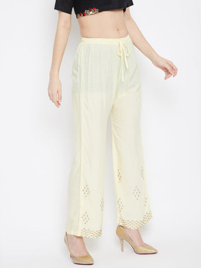 Cream straight embellished palazzo with stone work hem and elasticated waistband.