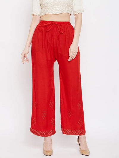 Red straight embellished palazzo with elasticated waistband and stone work on hem.