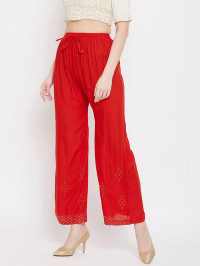 Red straight embellished palazzo with elasticated waistband and stone work on hem.