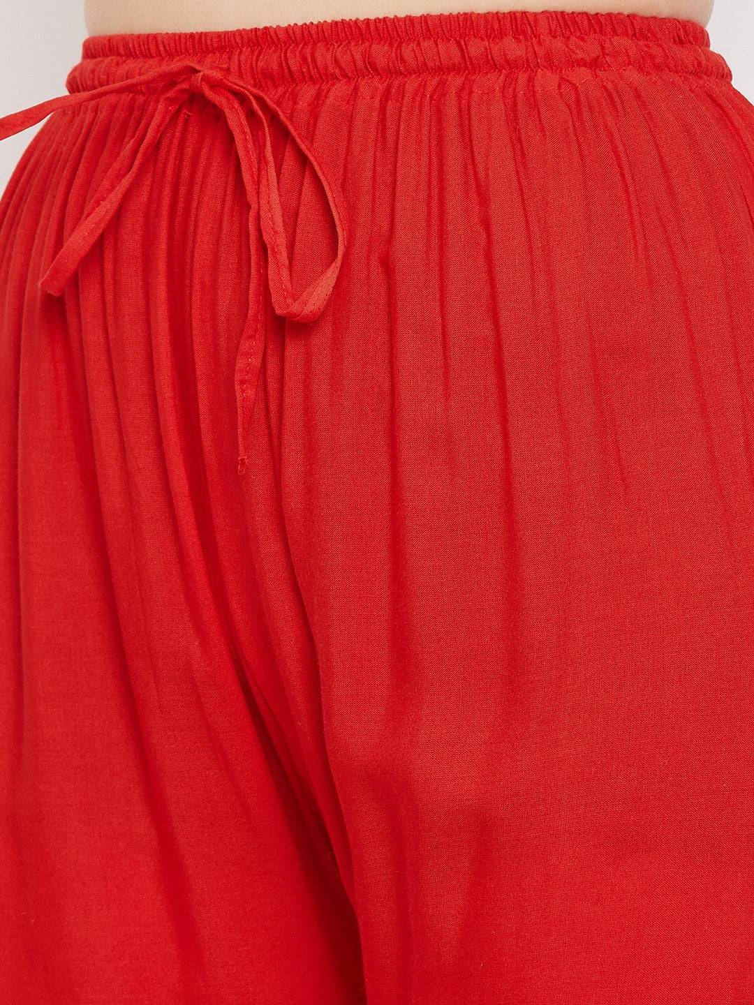 Red straight embellished palazzo with elastic waistband and stone work.