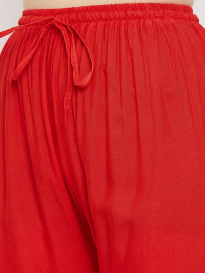 Red straight embellished palazzo with elastic waistband and stone work.