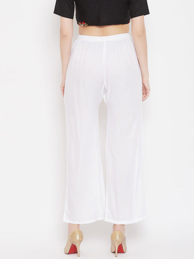 White straight embellished palazzo with stonework and elasticated waistband.