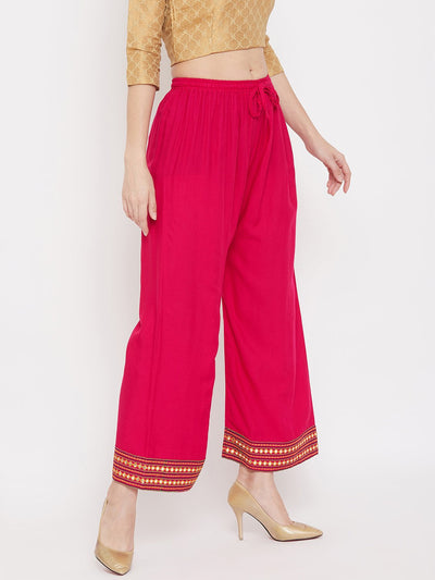 Magenta Hem Design Embroidered Straight Palazzo with gold embroidery on hem.