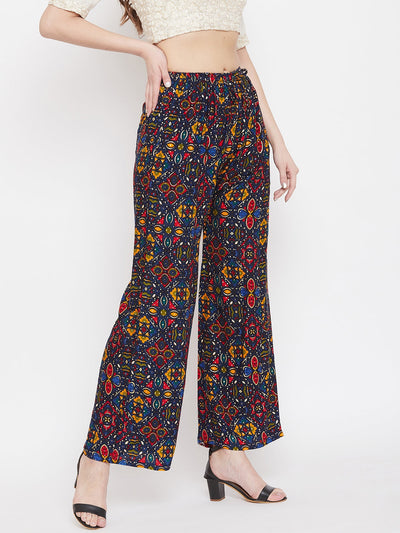 Navy blue printed rayon palazzo pants paired with heels, offering a stylish look.