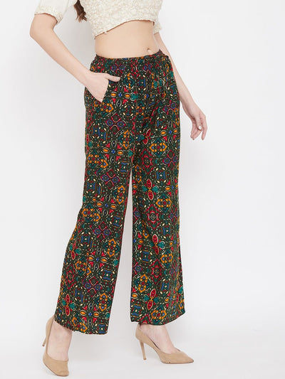 Bottle Green Printed Rayon Palazzo with vibrant pattern, styled with heels for a fashionable look.
