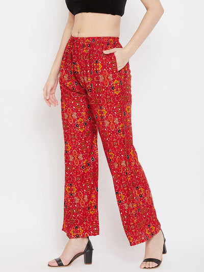 Red printed rayon palazzo with a vibrant design, perfect for social occasions.