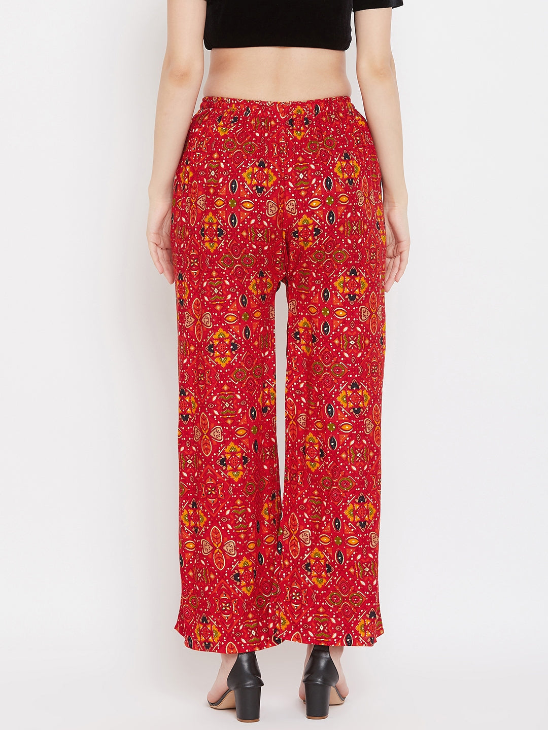 Red printed rayon palazzo with vibrant design, showcased from the back.