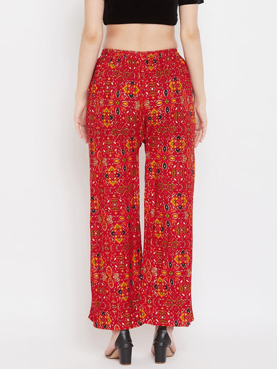 Red printed rayon palazzo with vibrant design, showcased from the back.