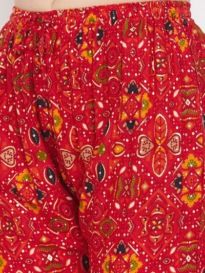 Red printed rayon palazzo with intricate floral design.