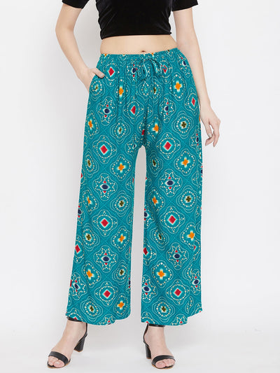 Turquoise printed rayon palazzo with vibrant patterns and an elastic waist.