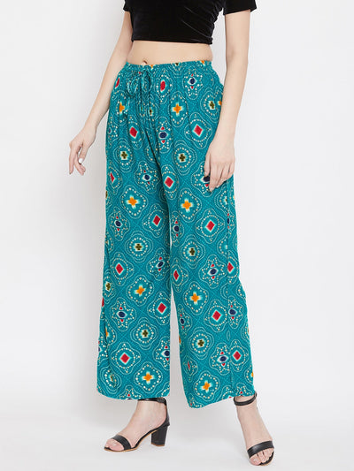 Turquoise printed rayon palazzo pants with colorful pattern.