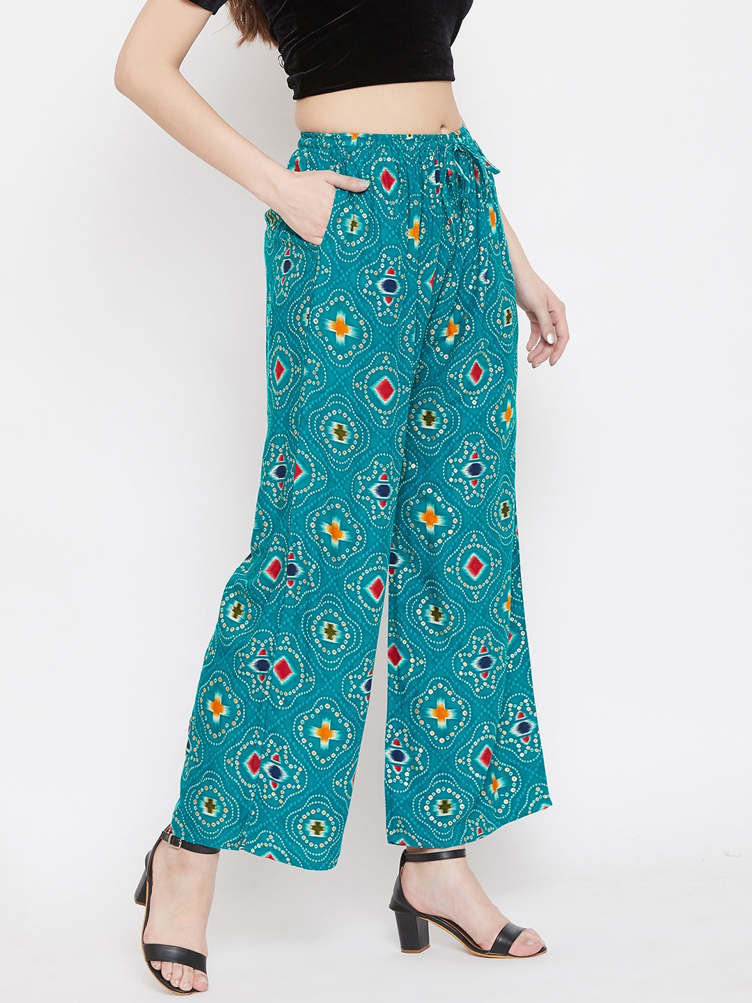 Turquoise printed rayon palazzo with a vibrant design, perfect for a stylish look.
