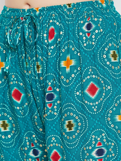 Turquoise printed rayon palazzo with vibrant geometric patterns.