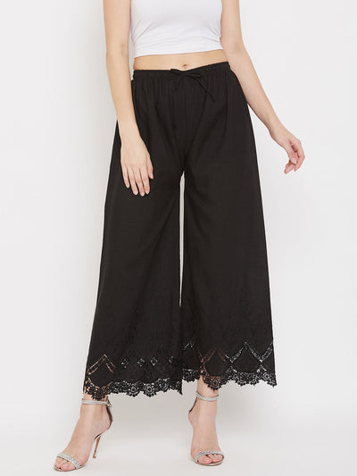 Black straight embroidered palazzo with elastic waistband and lace detailing.