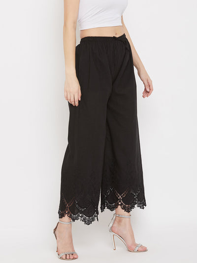 Black straight embroidered palazzo with elastic waistband and lace detail.