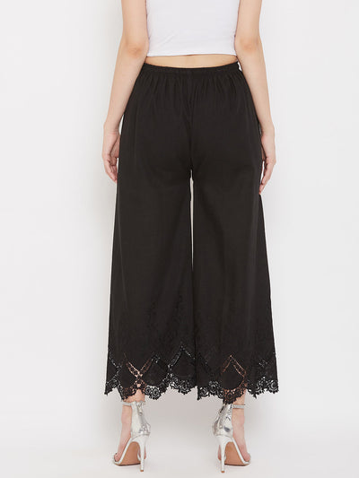 Black straight embroidered palazzo with elastic waistband and lace detailing, perfect for an elegant look.