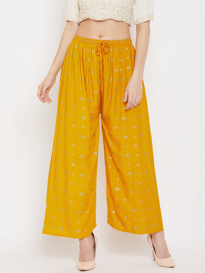 Mustard printed rayon palazzo with wide-leg design.