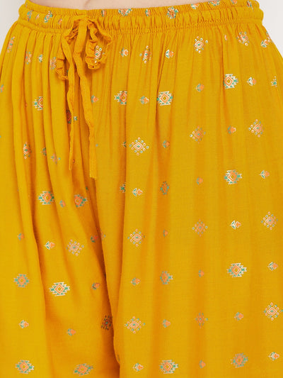 Mustard printed rayon palazzo with delicate patterns.