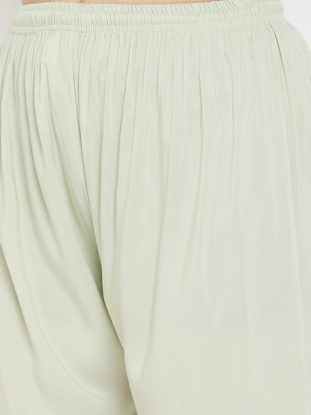 Pista Green Straight Solid Palazzo made of light-weight rayon fabric with elastic waistband.