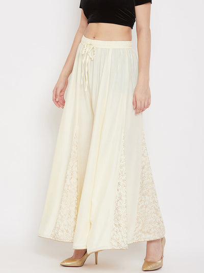 Cream printed rayon gharara with flared design, featuring lightweight comfort.