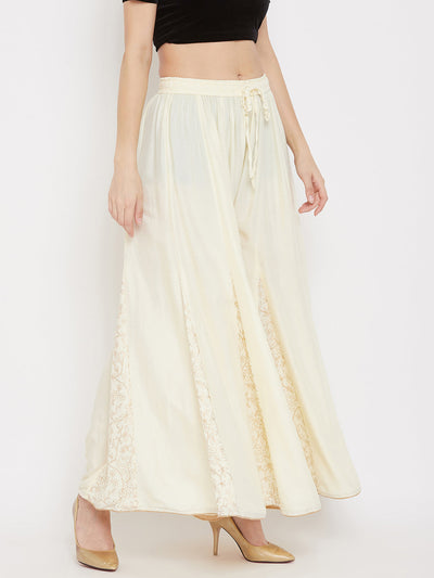 Cream printed rayon gharara with flared design, lightweight and comfortable for all-day wear.